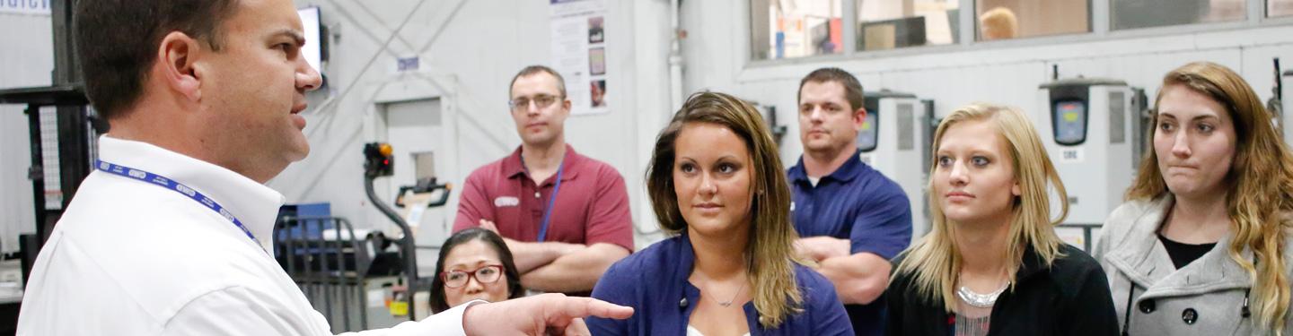 Students touring supply chain facility